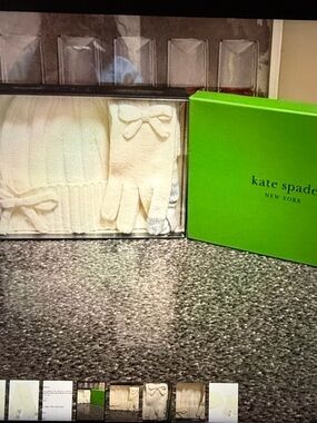 kate spade cream bow knit hat and touchscreen bow gloves. Retail 149.00